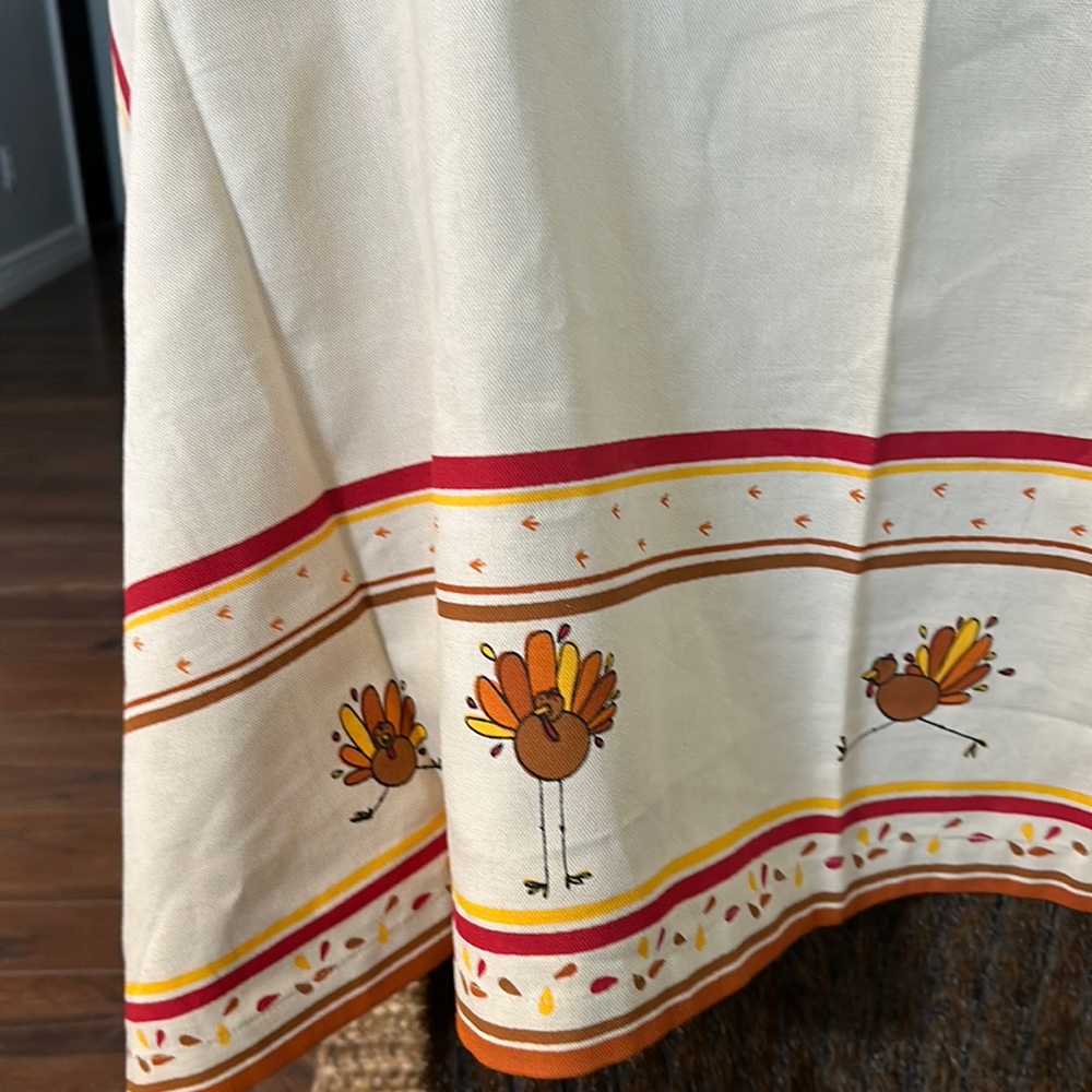 60 x 60 cotton tablecloth, trimmed in autumn colors and turkeys by tag